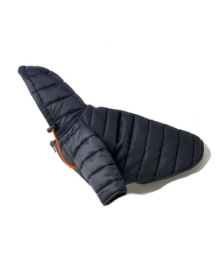 Sleek laydown view of the Wagwear puffer jacket in black, a stylish and functional canine fashion statement for keeping your furry friend warm and trendy.