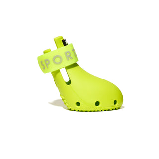 Bright green dog shoe with 'SPORT' label on a white background