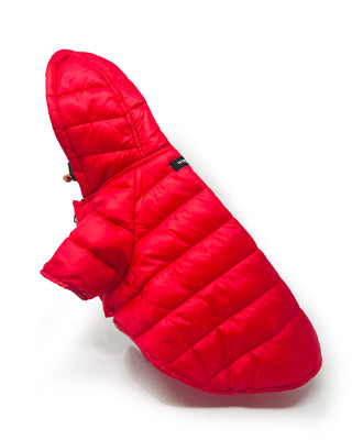 Sleek laydown view of the Wagwear puffer jacket in red, a stylish and functional canine fashion statement for keeping your furry friend warm and trendy.